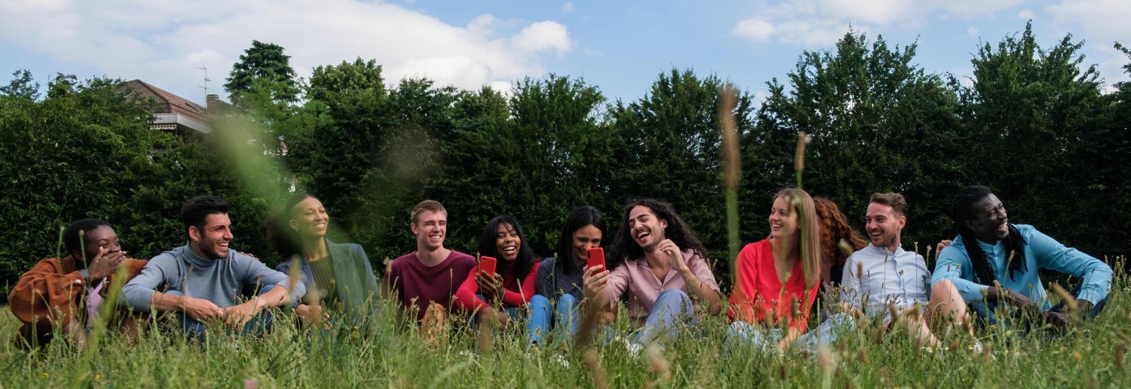 People gathered outdoors on a grassy field